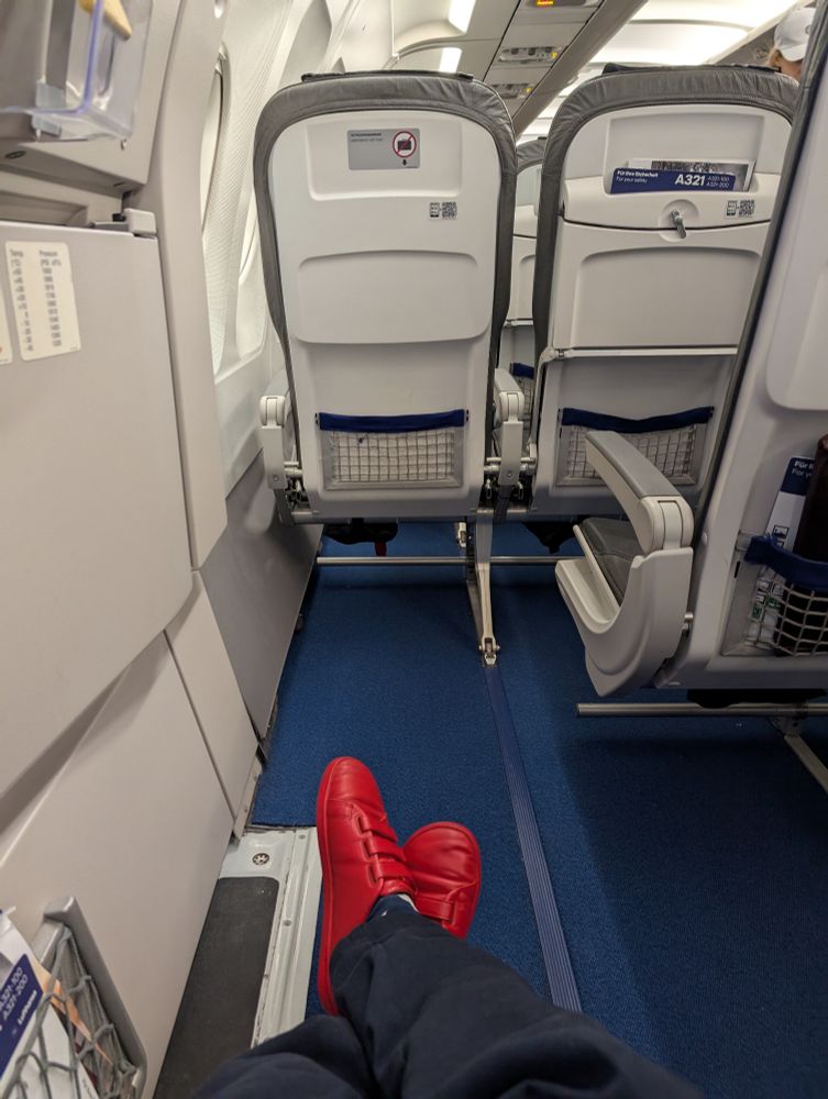 Emergency exit seat legroom space on a plane. 