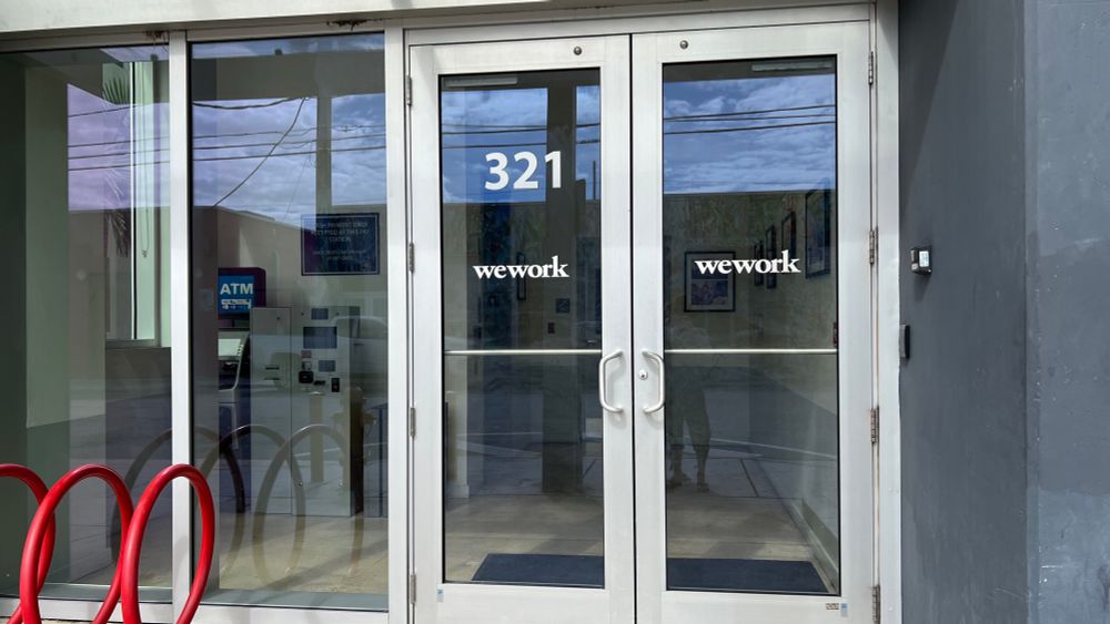 Locked and abandoned main entrance to the Wework building in Miami. 