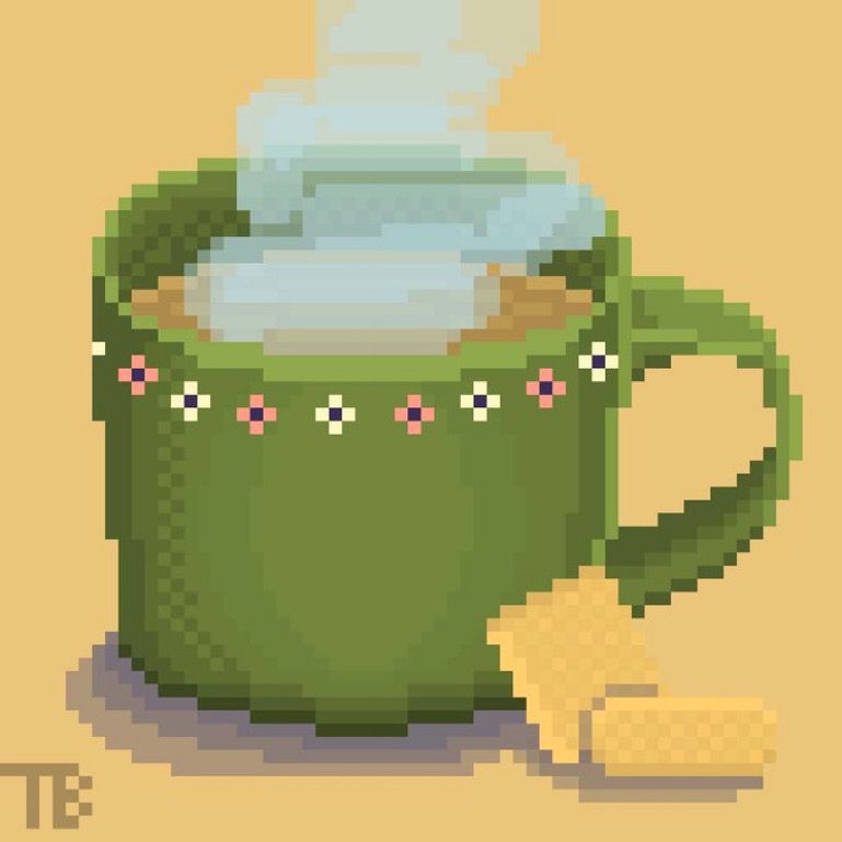 A green mug with flower designs on the rim, and steaming coffee inside. Two butter cookies are leaning against it.