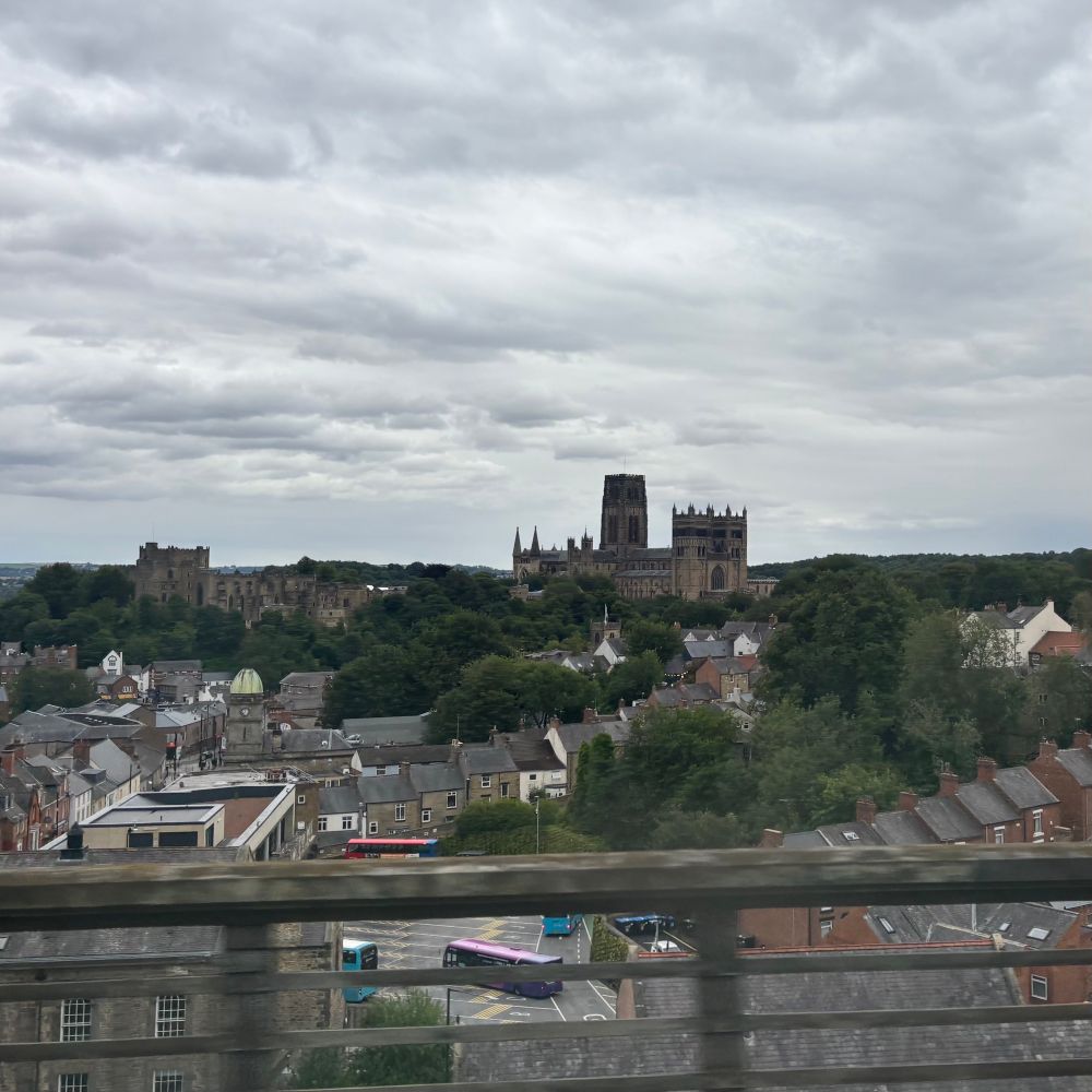 Durham Cathedral looming under a grey sky.