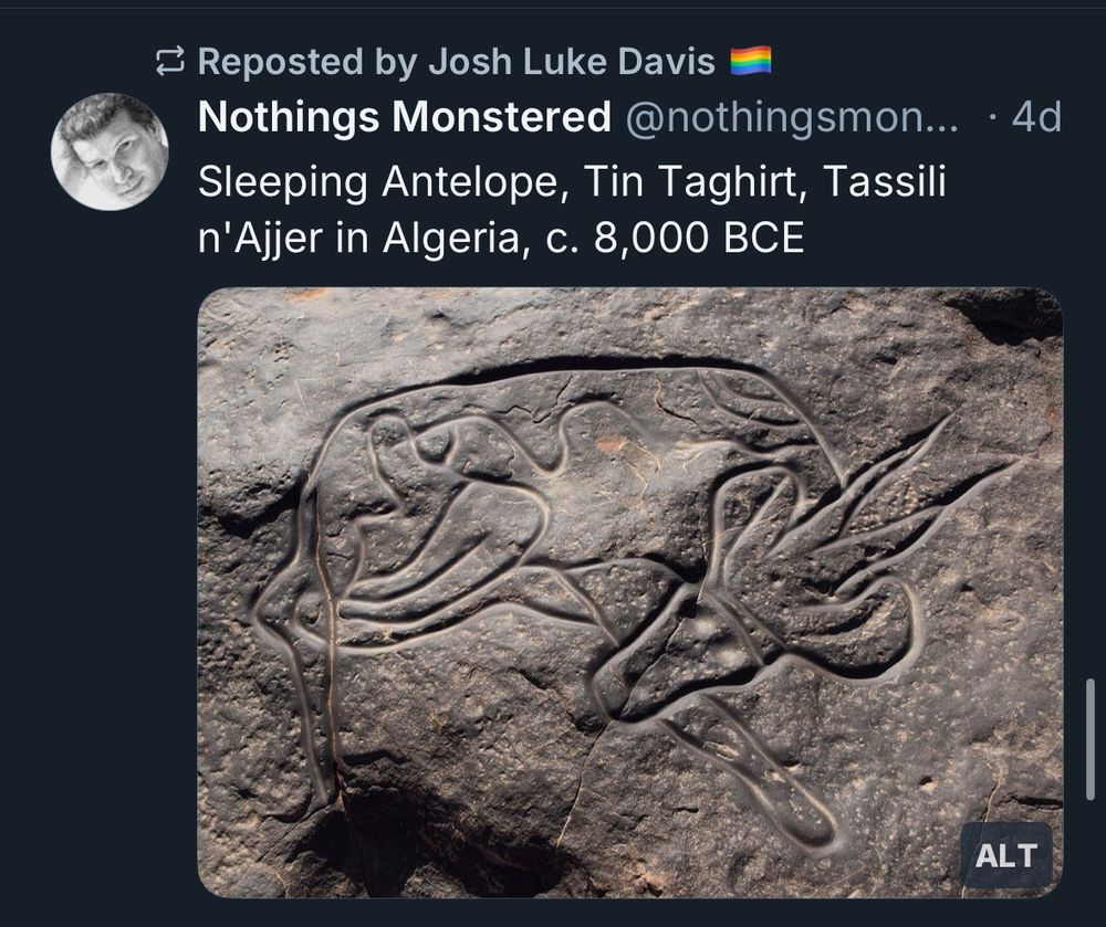 Image is a screenshot of a Bluesky post from an account called Nothings Monstered showing cave art of a sleeping antelope in Algeria from circa 8000BCE