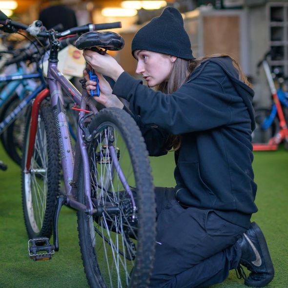 A mechanic fixing a bike