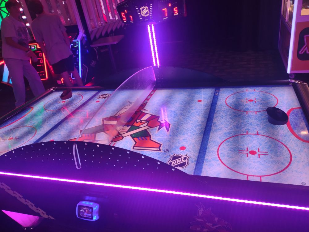 Air hockey table with Arizona Coyotes logo