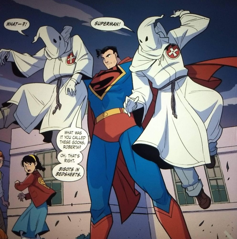 Superman holding up KKK members by their necks