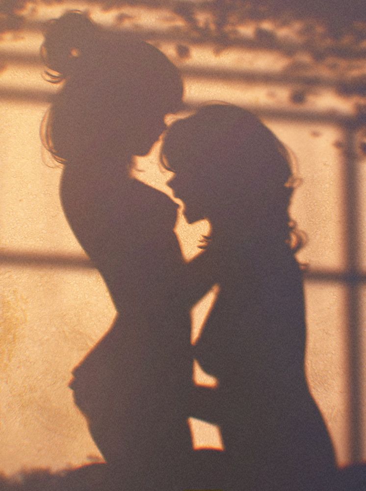an artwork showing the shadow of Spindle's characters, Asimov and Ottilie, making love to each other; Otti is about to nibble on Asi's nip