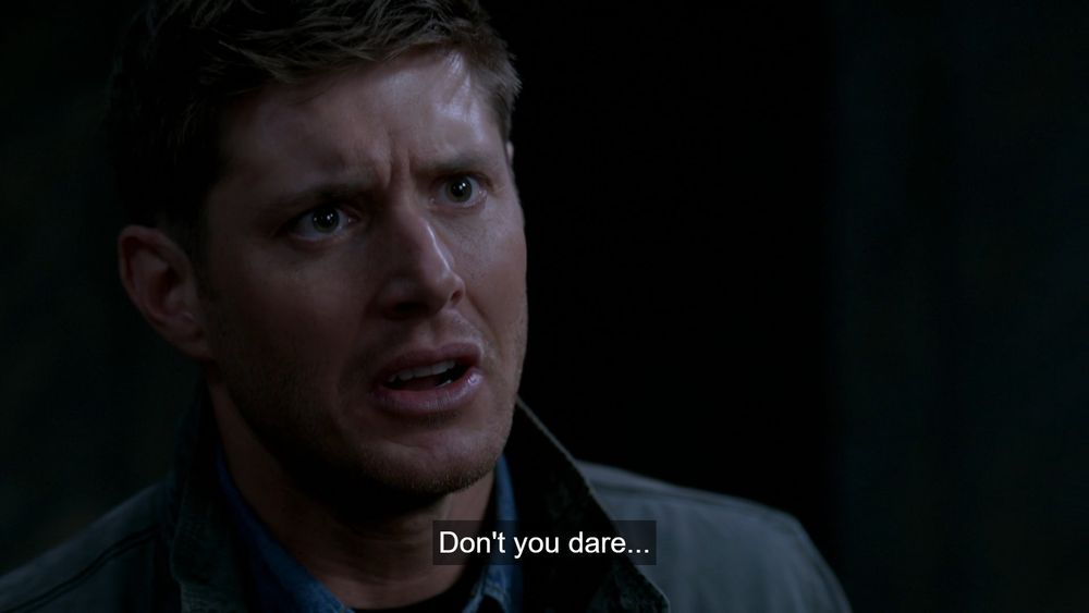 Dean Winchester wearing a jacket, with text "Don't you dare..." at the bottom. Scene from supernatural 