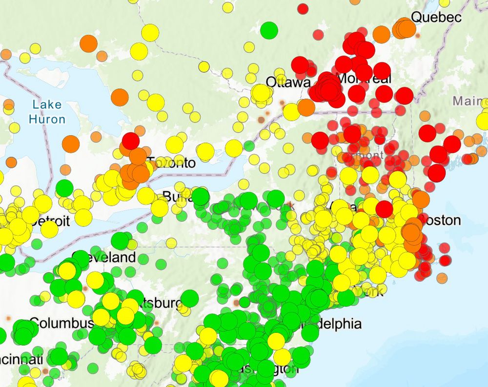 Orange and red dots on a map denoting wildfire smoke drift from Canada into the US Northeast 
