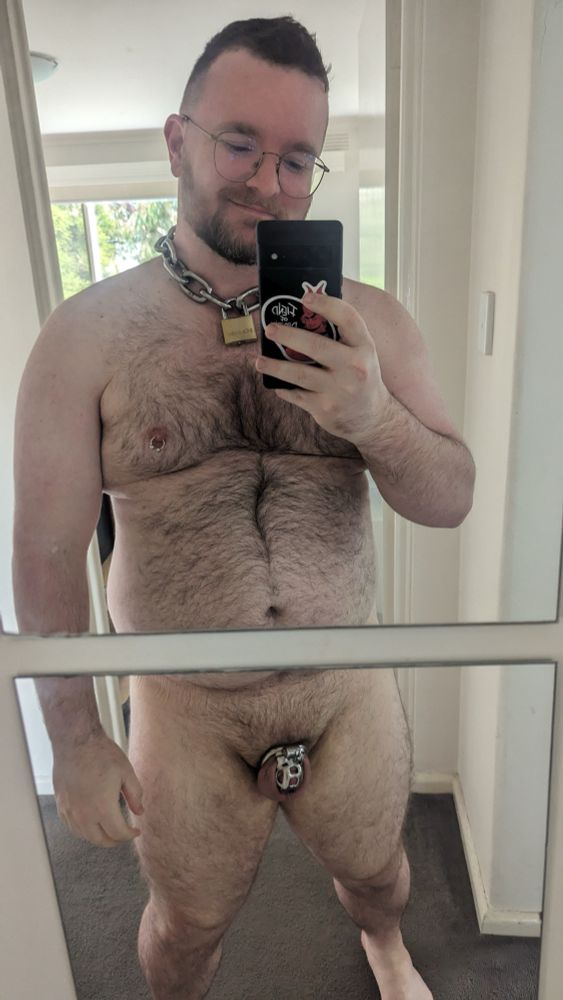 Me caged and standing in front of a mirror in 2023