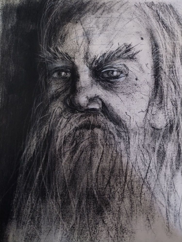 A charcoal portrait of an old man with a big beard
