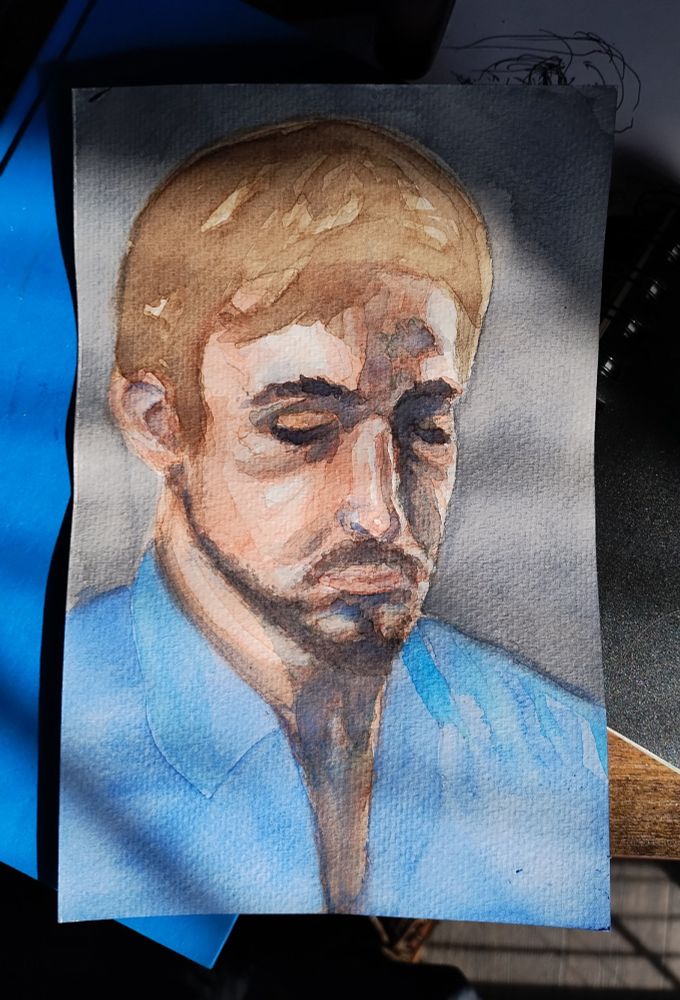 Watercolor portrait of a person with their eyes closed