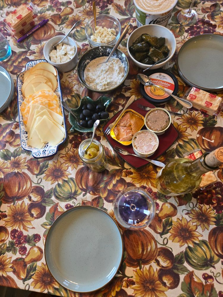 Cheese tray, feta, boursin, crab dip, hummus, dolmeh, cheddar dip, olives, rillette, smoked trout. Not pictured, crackers & mini naan