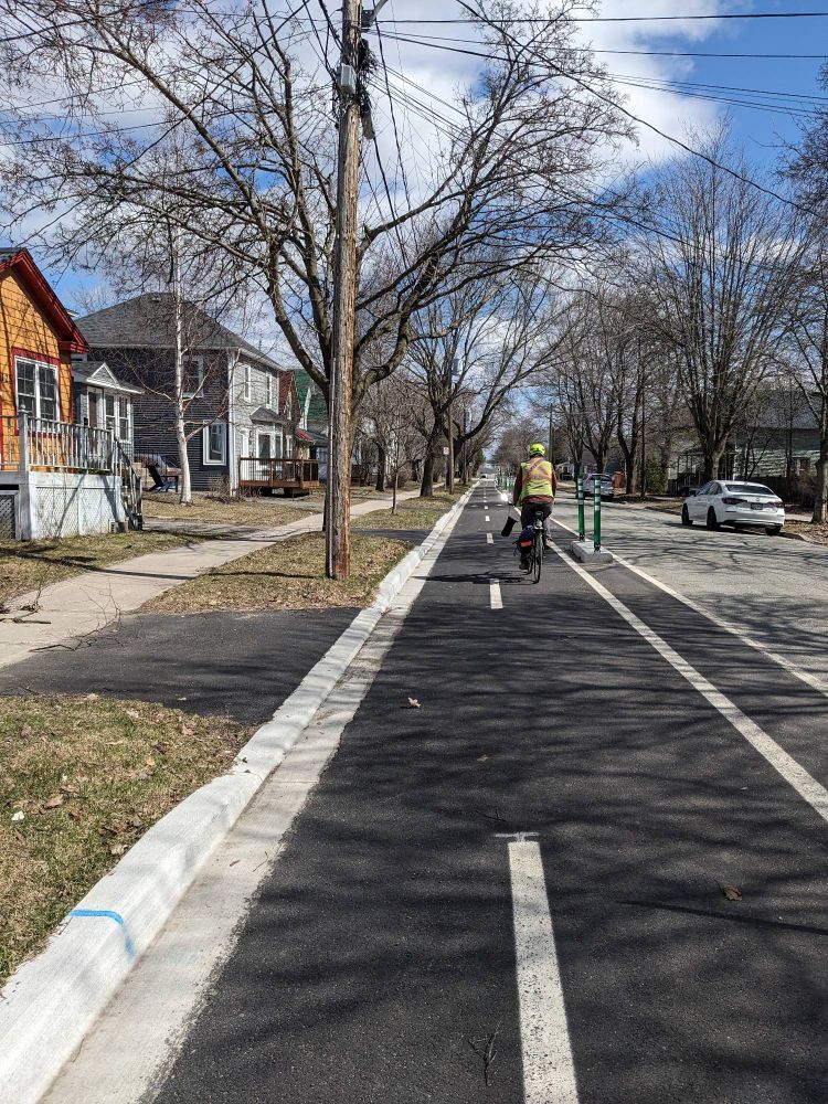 A new two-way cords town bike path on a residential street..