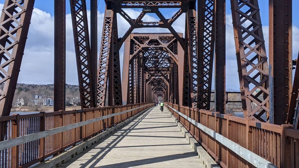 An old railroad bridge converted to a pedestrian and bike bridge. The picture shows only one cyclist but it was busy all four times we crossed. 