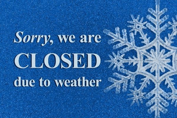 A snowflake on the right and text that says "sorry we closed due to the weather"