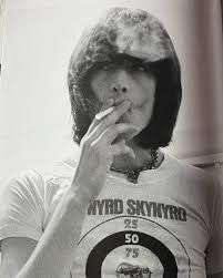 Dee Dee Ramone smoking a cigarette