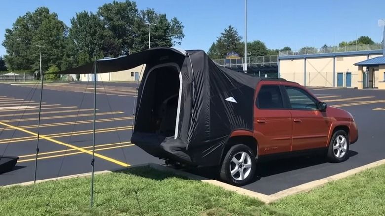 Pontiac Aztek with the black tent.  