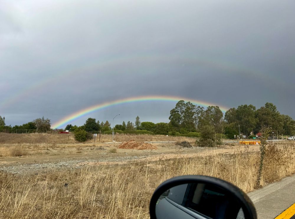 double rainbow over a dark sky
