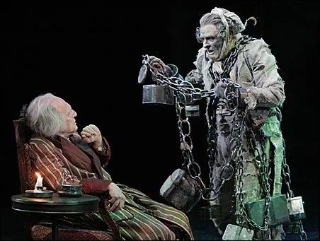 Scene from Charles Dickens‘s a Christmas Carol, the ghost of Jacob Marley in chains is confronting Scrooge.