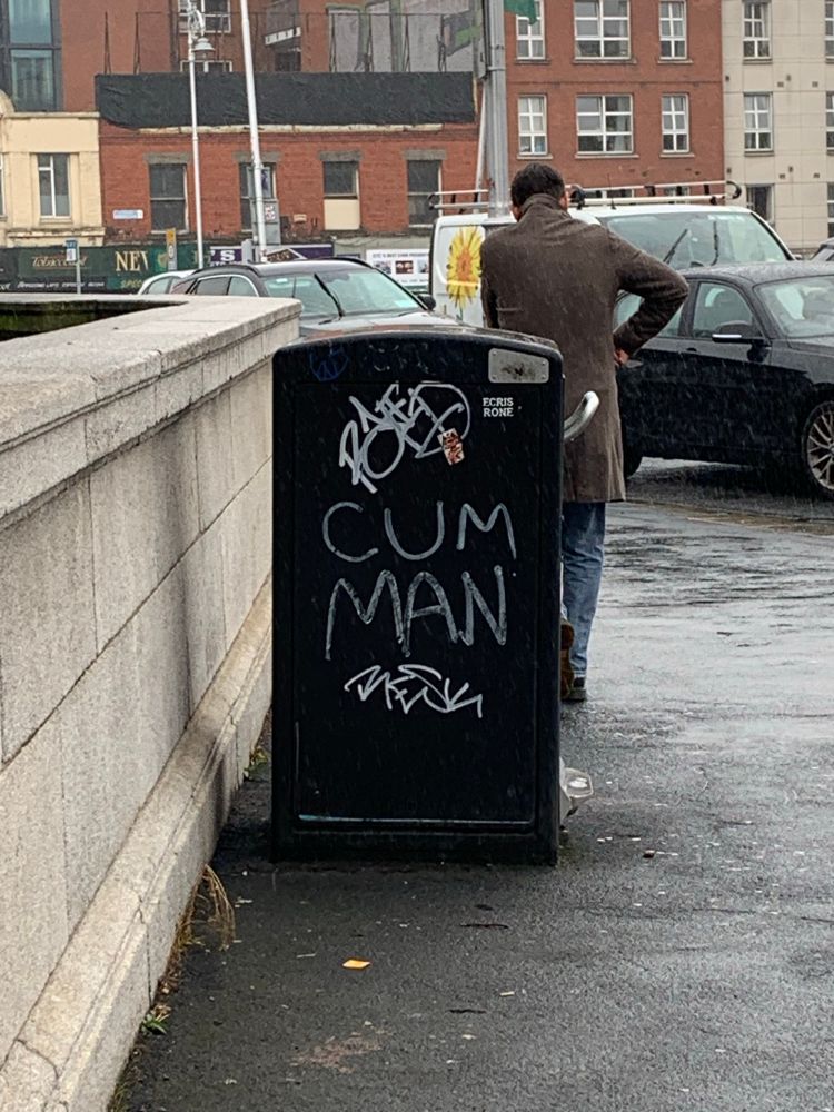 A bin with the words ‘CUM MAN’ scrawled on the side