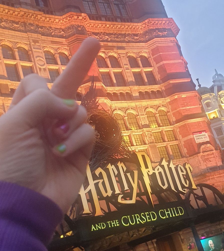 Pointing a middle finger at the Palace Theatre which is hosting JK's shitty wizard play for assholes.