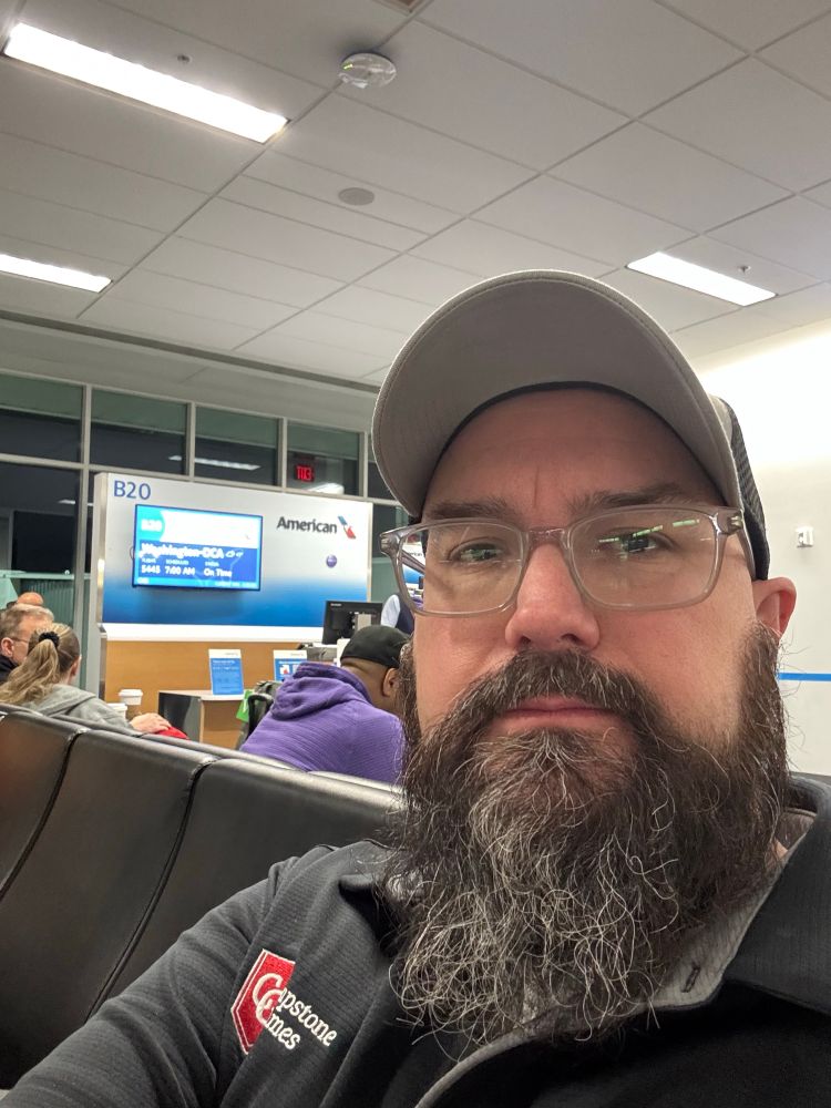 Me looking tired about to board an American Airlines flight to Washington DC in my Capstone polo