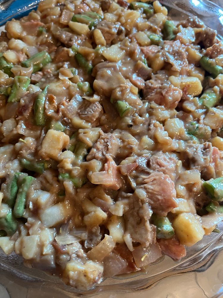 Filling in pie plate. Diced steak and potatoes with fresh green beans.