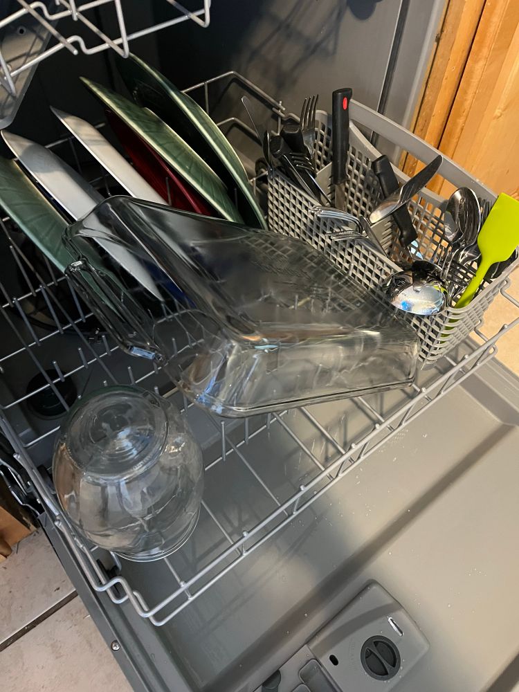 Inside of new dishwasher that actually works! Dishes are CLEAN!