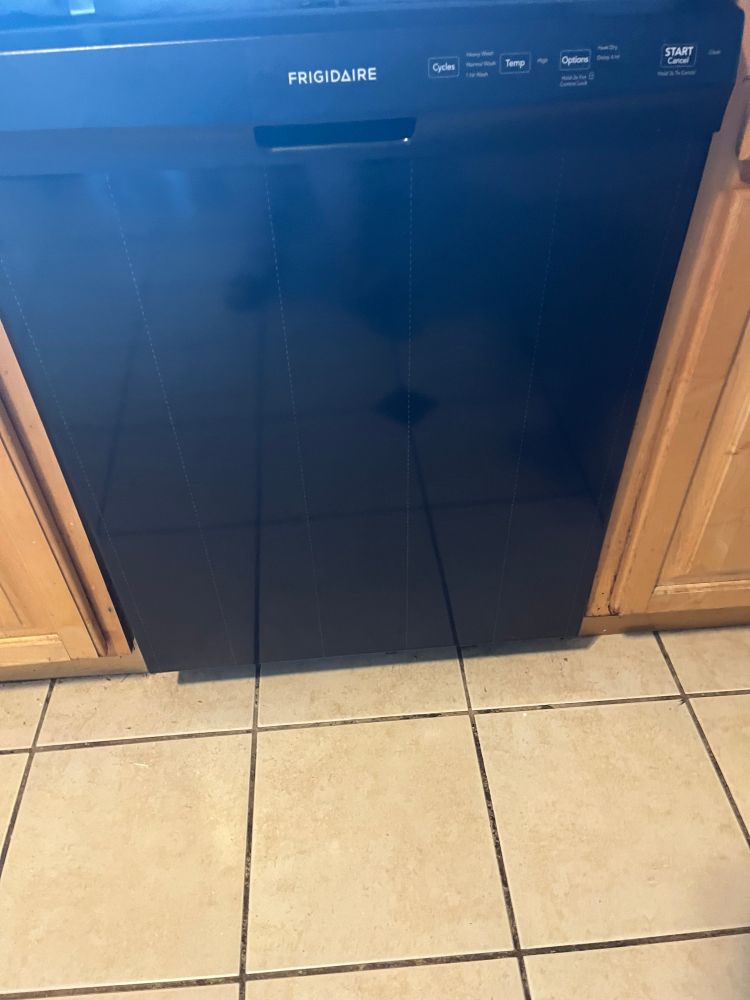 Shiny new black dishwasher installed.