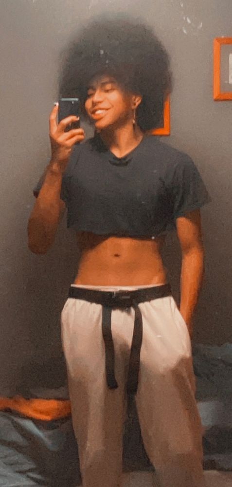 karma dressed up as gojo, just in a crop top