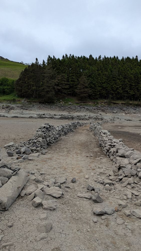 As Haweswater drops the remains of the walls of the streets of Mardale Green become visible. Destroyed in the late 1930s for ordnance testing ahead of the valley being dammed. It's amazing to see that the walls remain.