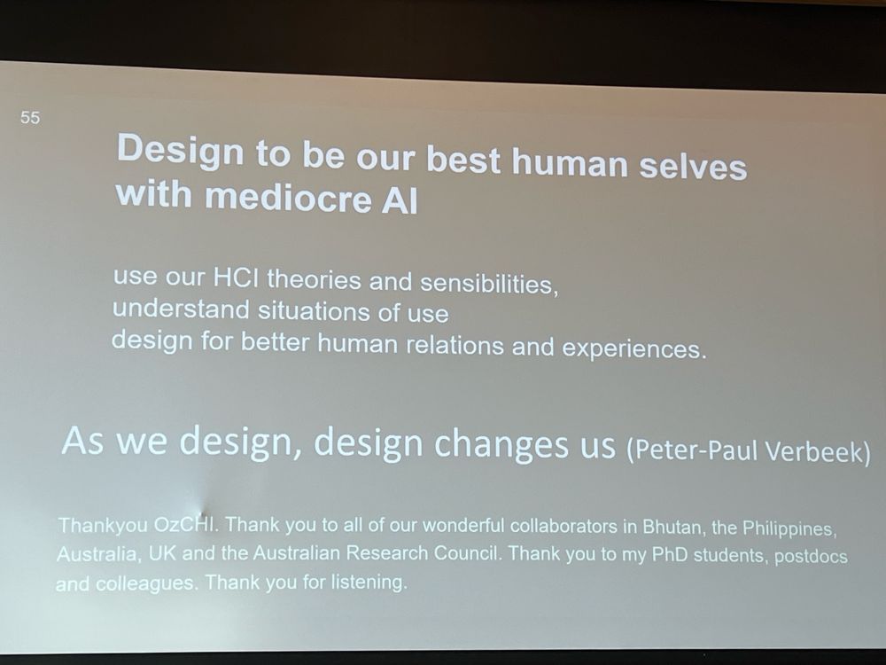 Photo of a slide with the title of a talk and a quote that says As we design, design changes us