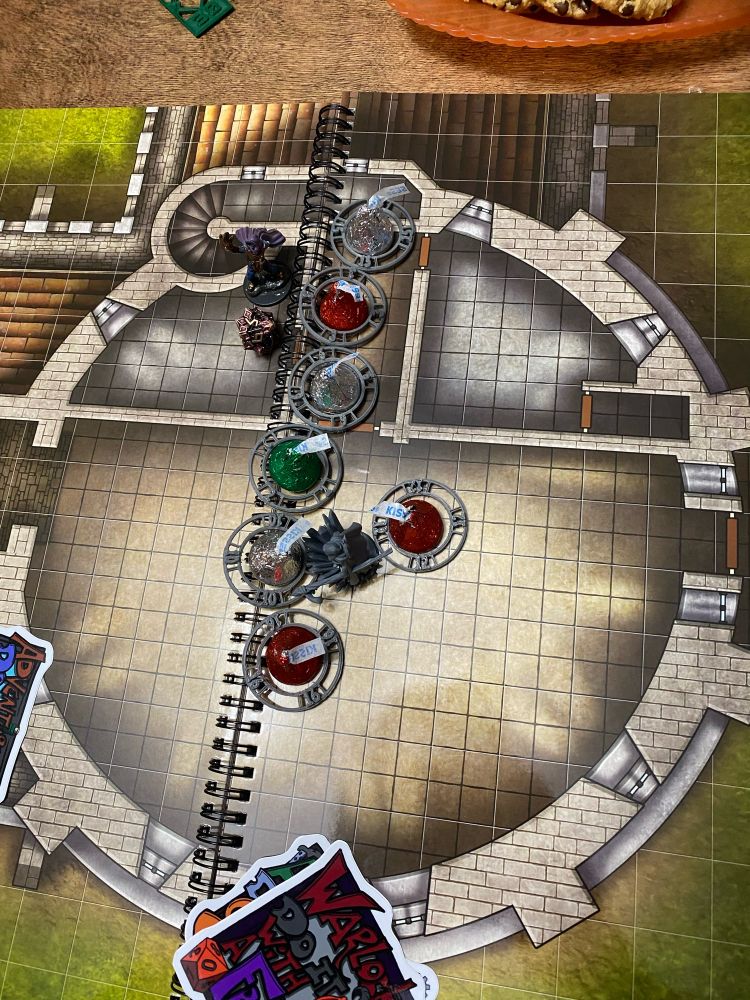 Round tower map with minis and candies in foil used for battle.