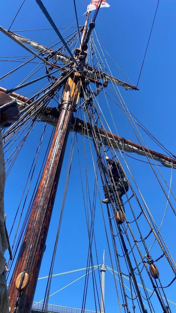 Photo of me climbing the main shrouds of a topsail schooner tall ship