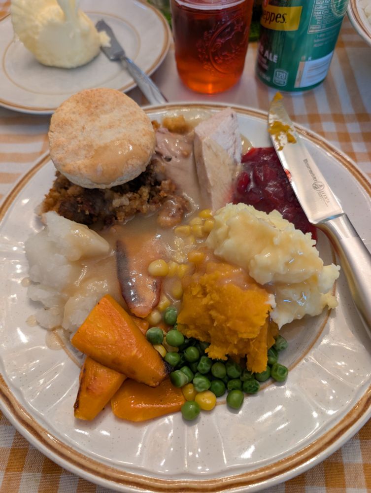 A plate full of thanksgiving food.