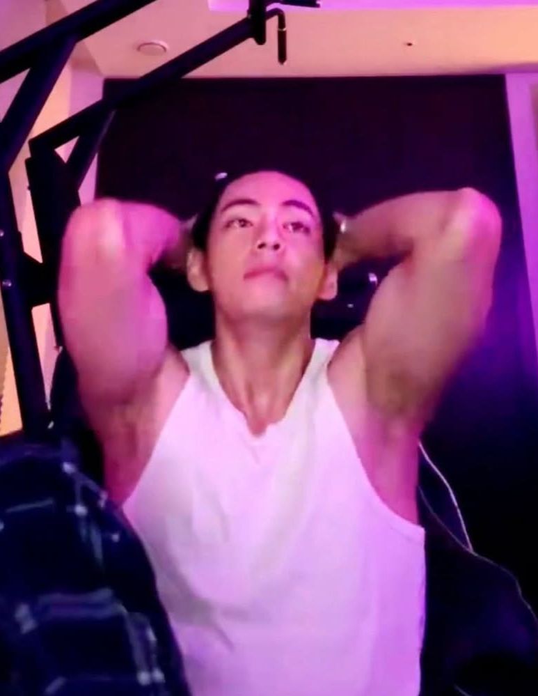 Kim Taehyung aka V of BTS on Weverse Live. Wearing a white ribbed tank top and running his hands through his hair showing his armpits 🙇🏻♀️