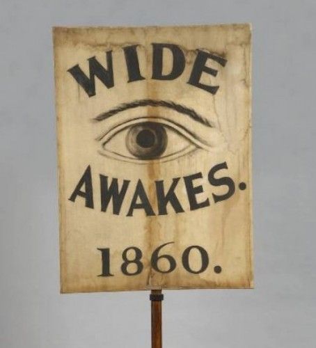 Wooden sign with an eye, the words "Wide Awakes," and the date 1860.