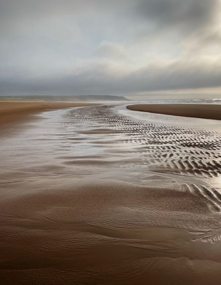 A beach somewhere in Scotland without an orange blob of the sunrise/sunset, blazing uninterrupted blue of the sky or screaming people complaining it’s not hot enough. 