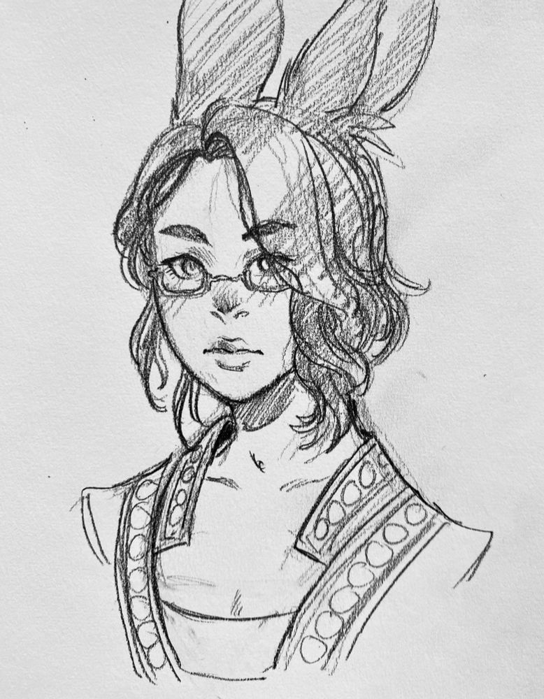 A headshot of Sol with her hair up, relaxed.