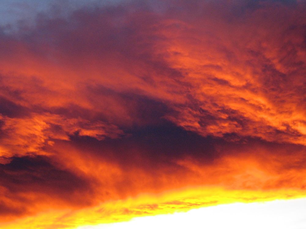 Image of dramatic, fiery orange and yellow clouds.