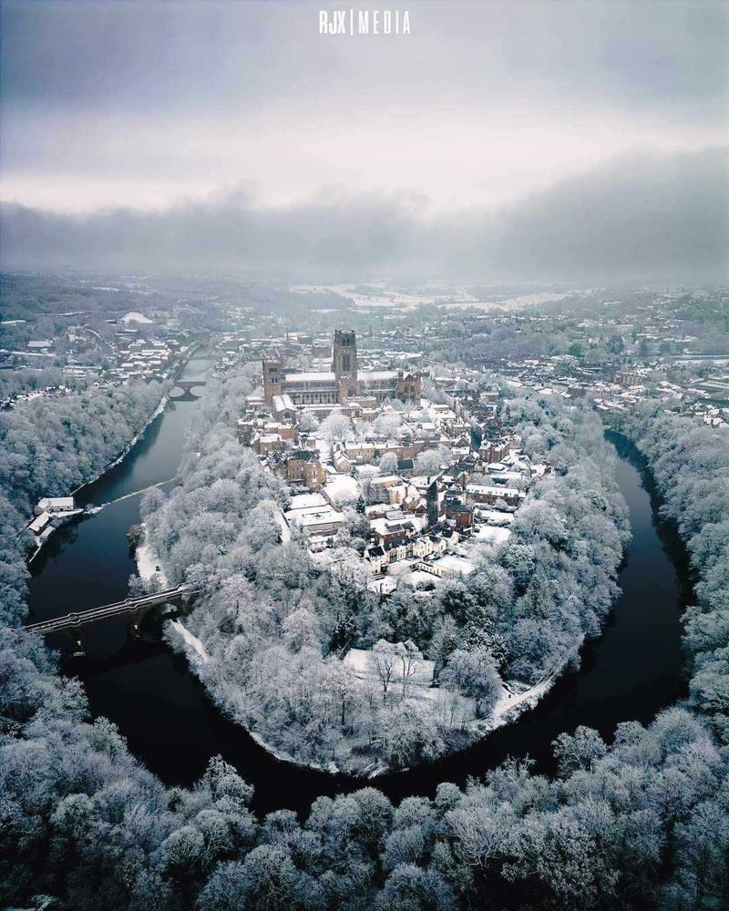 An aerial photo of the centre of Durham city on a snowy winter day. A river encircles the centre containing Durham's Castle and Cathedral.

Photo courtesy of RJX Media.