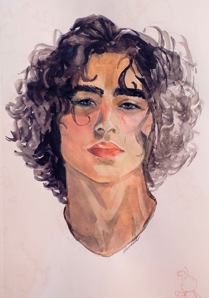 A portrait of a young man with curly hair and luscious lips . His skin is a warm tanned color with bushy eyebrows and bedroom eyes