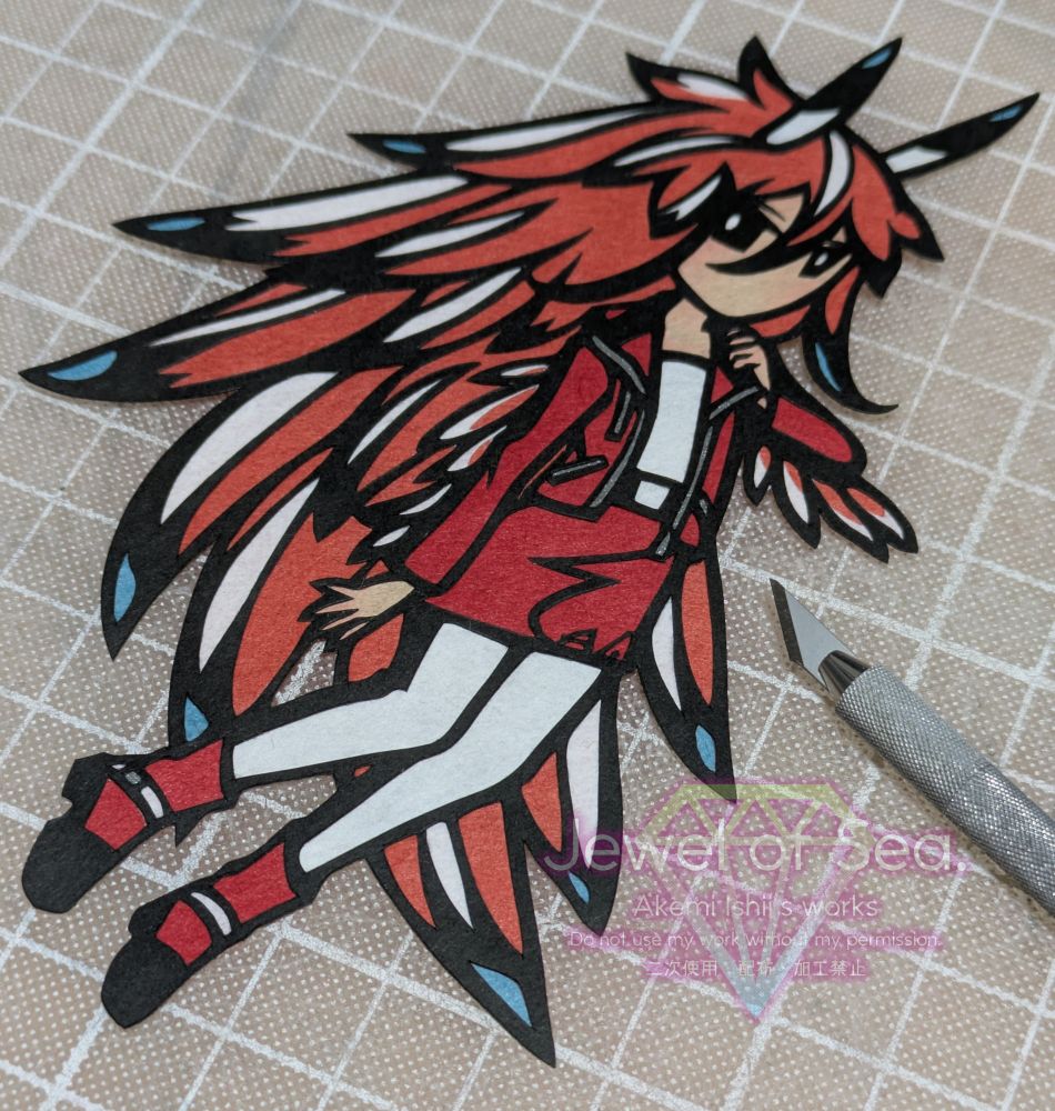 ツマグロミノウミウシをイメージした女の子の切り絵作品。