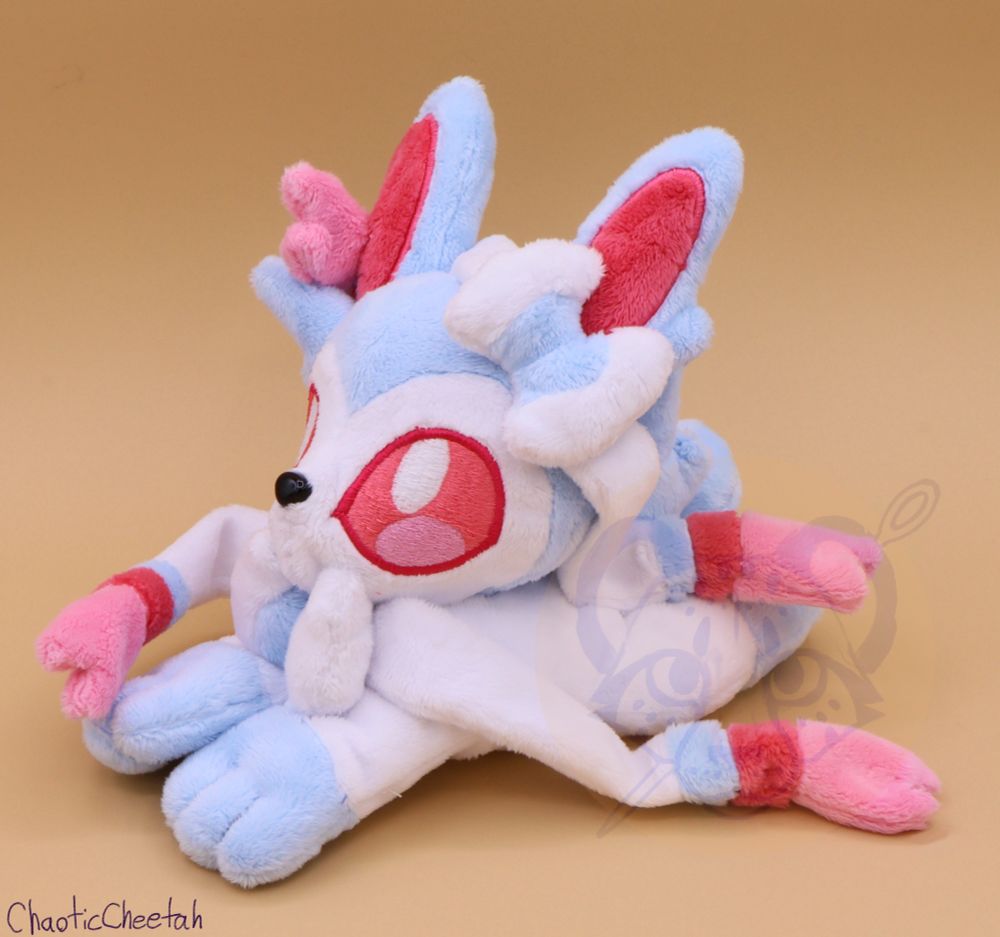 Shiny sylveon handmade plush made by chaotic cheetah. Pattern by magnastorm on deviantart. Modifications and embroidery by me. 