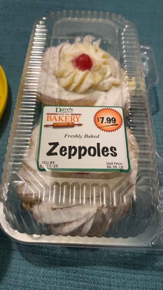 A box of zeppole (an Italian treat that’s like a big cream puff) with the label that says “Zeppoles”
