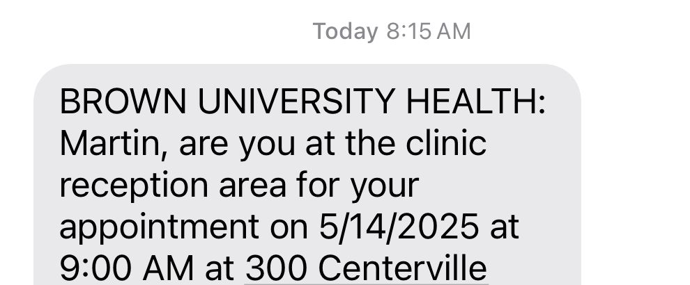 Screenshot of a text received at 8:15am saying “BROWN UNIVERSITY HEALTH: Martin, are you at the clinic reception area for your appointment on 5/14/2025 at 9:00 AM”