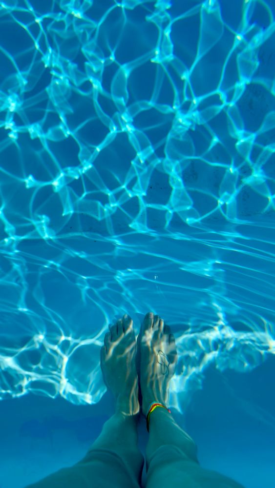 Rachel’s feet in the pool