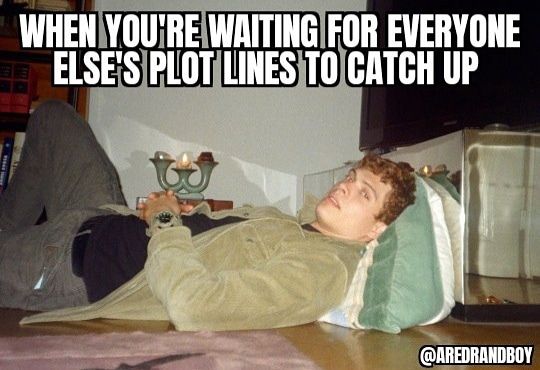 A picture of Josha Stradowski the actor that played Rand al'thor laying down relaxing on a floor he's looking at the camera like what above him it says when you were waiting for everyone else's plot lines to catch up.