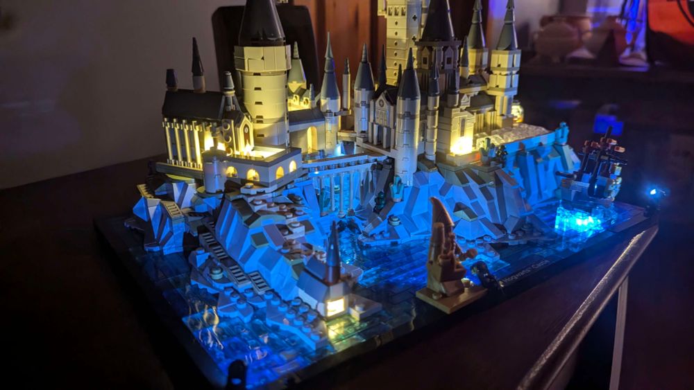 the "hogwarts and grounds" Lego kit, assembled, and lit with various LEDs