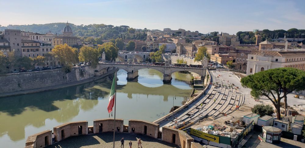 City of Rome from a high vantage point looking down the Tiber River with one of the crossings in view.