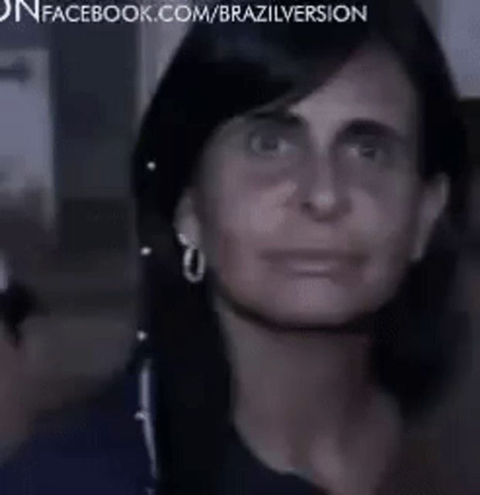 a close up of a woman 's face with a facebook.com/brazilversion watermark in the corner .